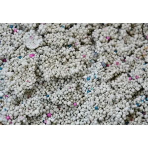 Close up of Bentonite Cat Litter Clump with Multi colored Particles from Isemipet