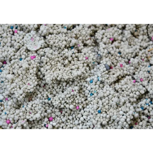 Close up of Bentonite Cat Litter Clump with Multi colored Particles from Isemipet