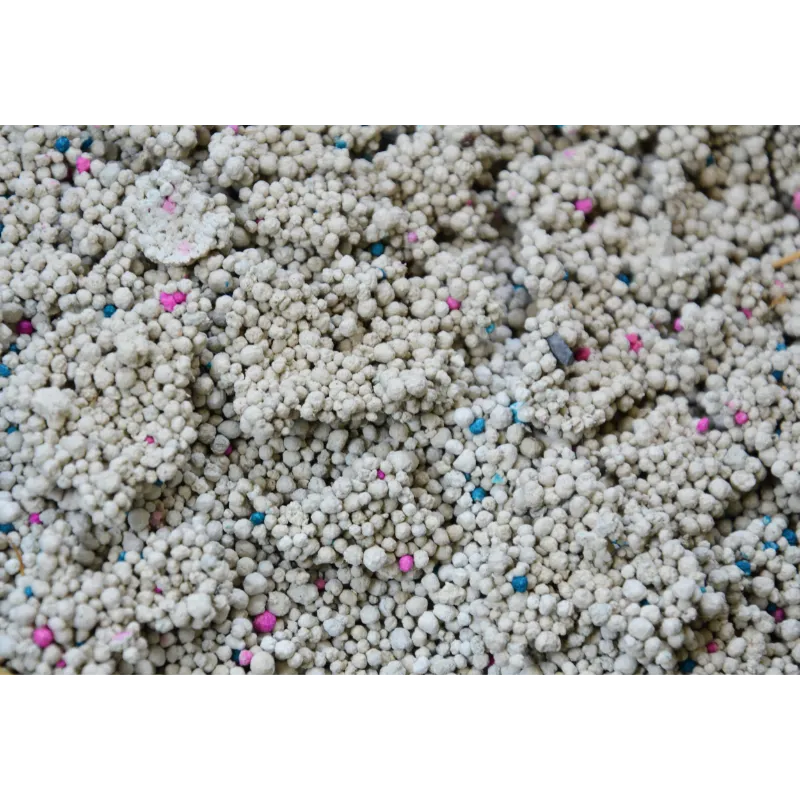 Close up of Bentonite Cat Litter Clump with Multi colored Particles from Isemipet