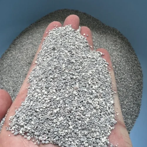 Hand Holding Fine Particle Size Bentonite Cat Litter in Soft Gray by Isemipet