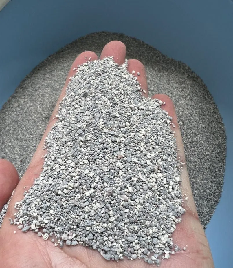 Hand Holding Fine Particle Size Bentonite Cat Litter in Soft Gray by Isemipet
