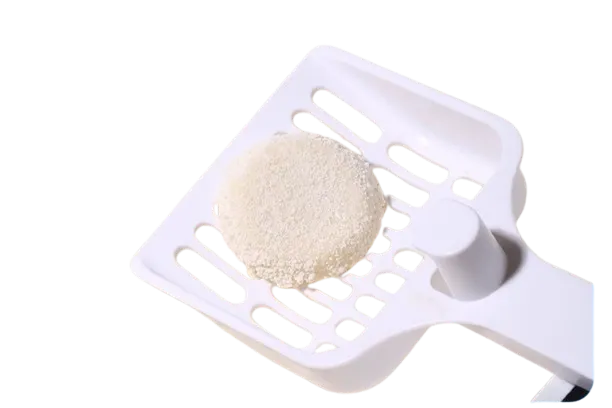 Clumped Cassava Cat Litter on White Plastic Scoop