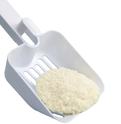 Close up of Cassava Cat Litter in Plastic Scoop
