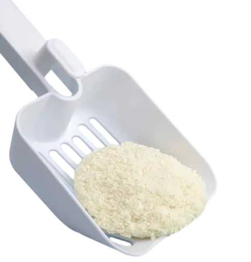Close up of Cassava Cat Litter in Plastic Scoop